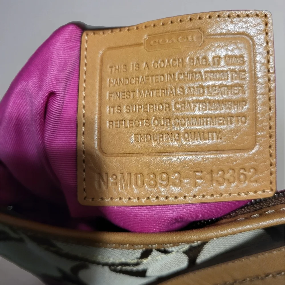 Coach Rugby Stripe Signature Duffle Bag.